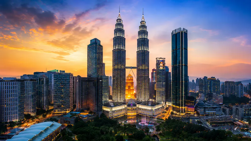 Tropical sunset route in Malaysia with coast, forest and mountains